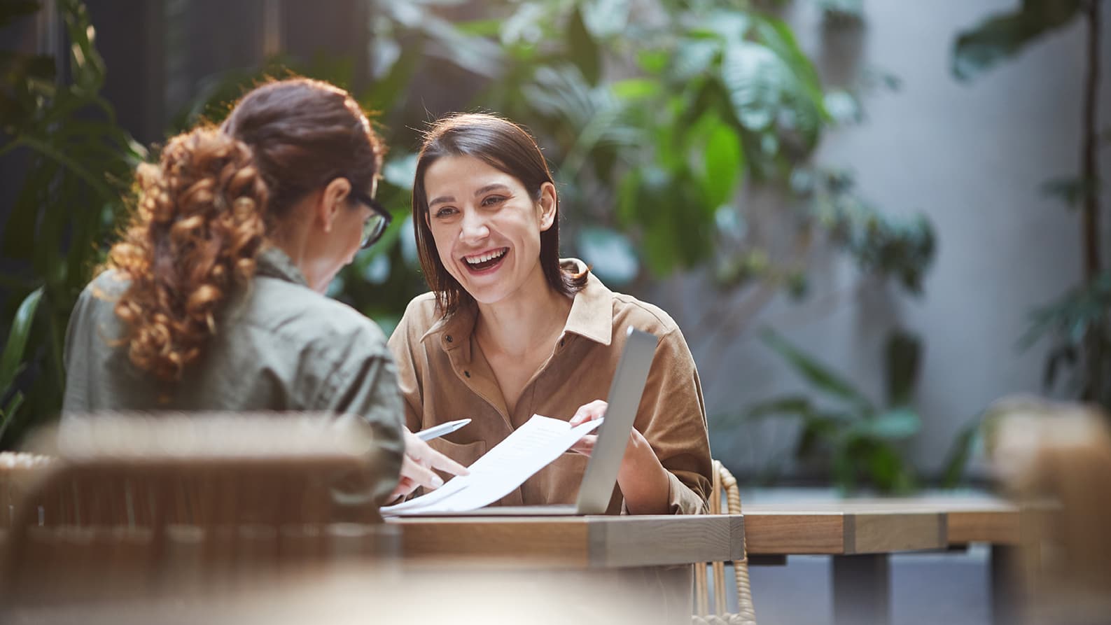 Two women brainstorming their startup